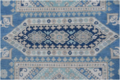 Handmade Afghan Kazakh rug featuring a geometric medallion pattern in shades of blue and beige.