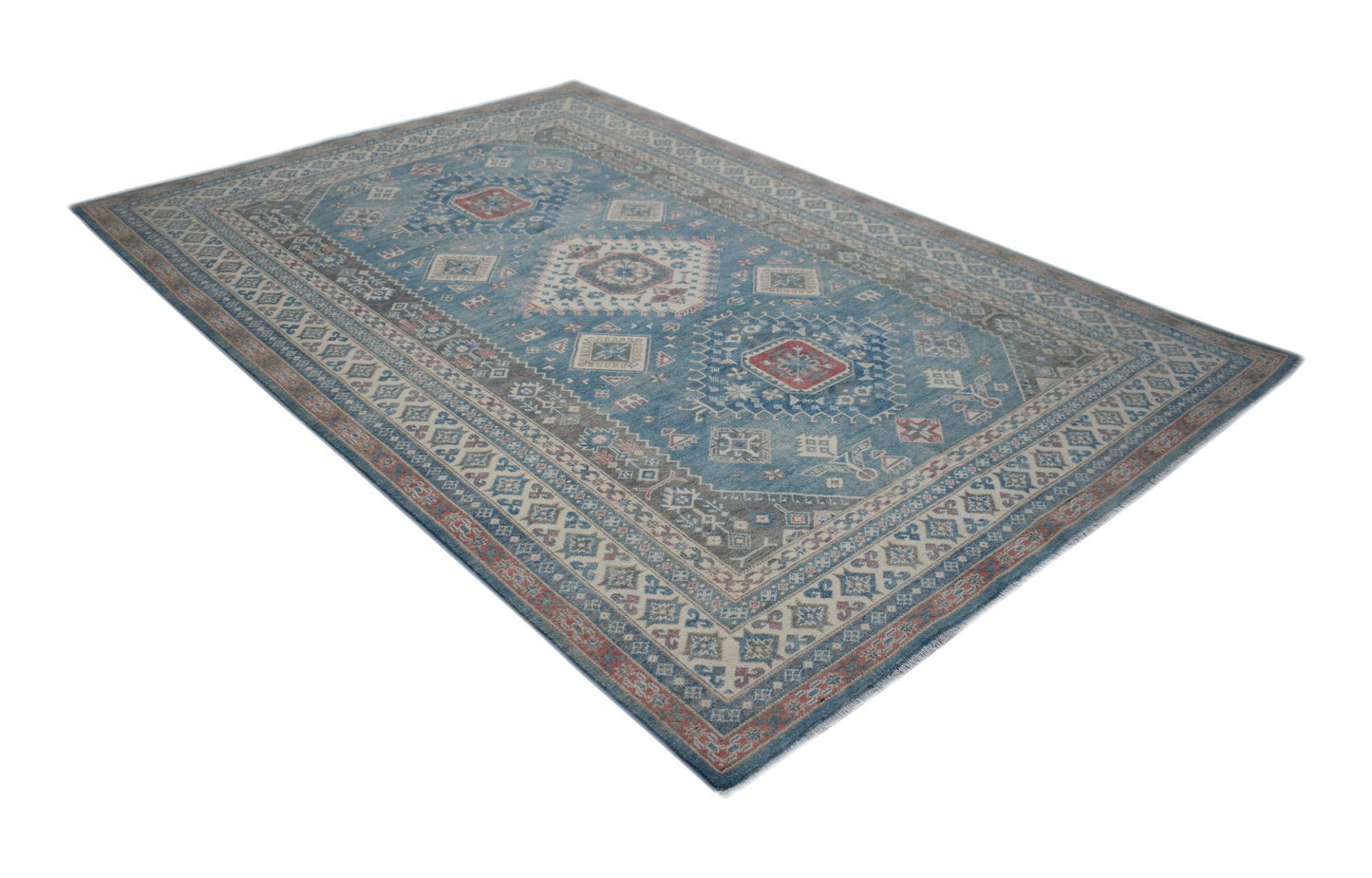 A handmade Afghan Kazakh rug featuring traditional geometric motifs in blue, red, and cream tones.