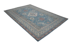 A handmade Afghan Kazakh rug featuring traditional geometric motifs in blue, red, and cream tones.