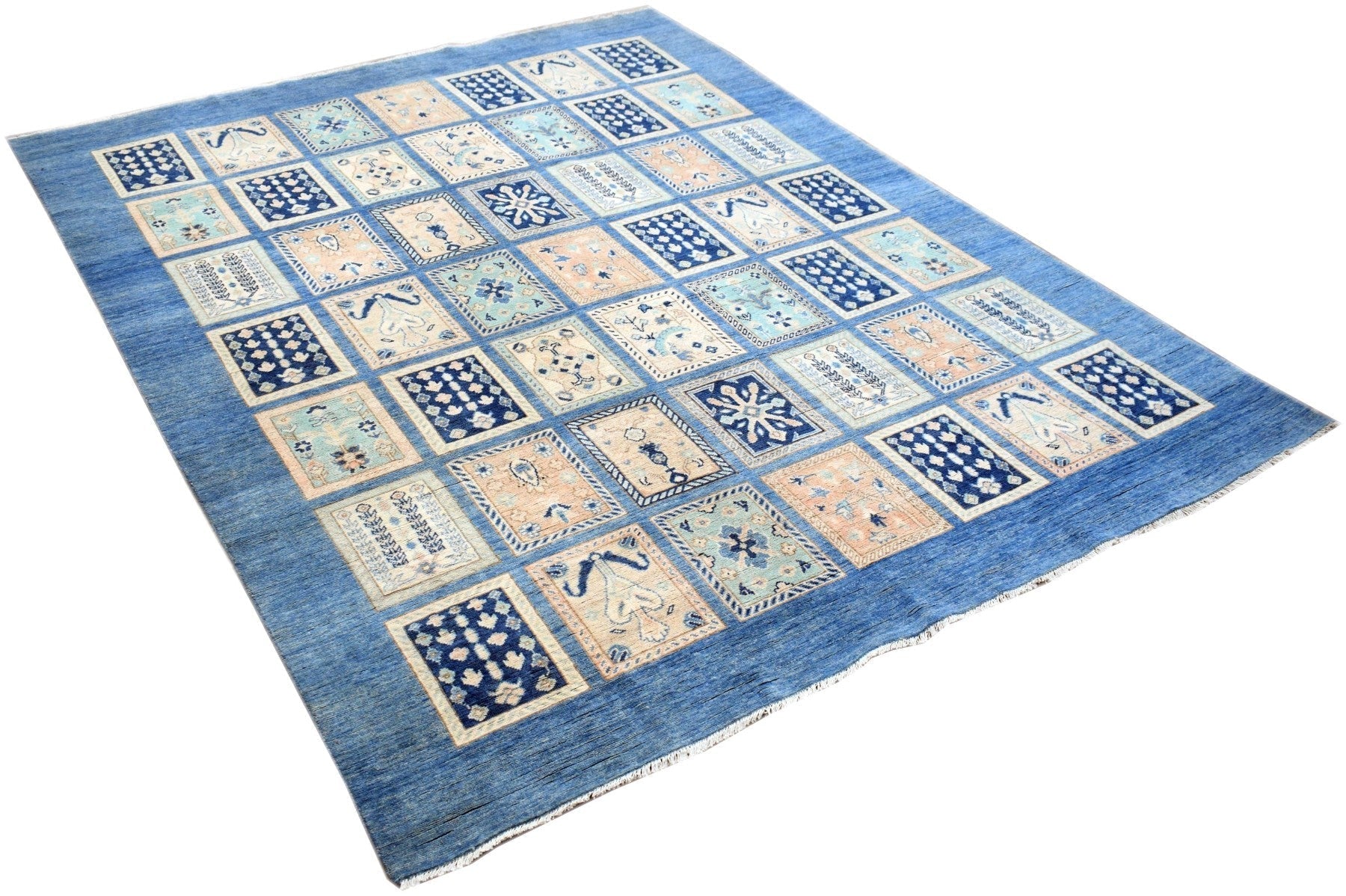 Handmade Afghan Kazakh rug featuring a blue field with a grid of patterned rectangular motifs.