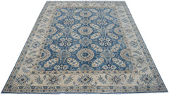 Handmade Afghan Kazakh rug featuring a traditional blue and beige floral medallion pattern.