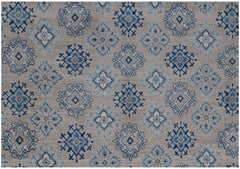 Handmade Afghan Kazakh rug featuring a repeating geometric floral pattern in blue and beige tones.