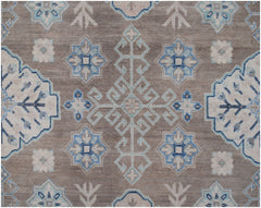 Handmade Afghan Kazakh rug featuring a geometric pattern in shades of beige, blue, and grey.