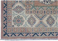 Handmade Afghan Kazakh rug featuring traditional geometric motifs in blue, pink, and cream tones.