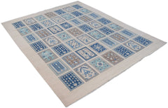 Handmade Afghan Kazakh rug featuring a grid of blue and beige geometric floral patterns.