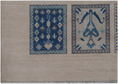 An Afghan Kazakh rug featuring two rectangular panels with blue and beige geometric patterns.