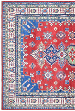 Handmade Afghan Kazakh rug featuring a red field with blue geometric medallions and floral borders.