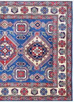Handmade Afghan Kazakh rug featuring geometric medallions in red, blue, and cream wool.