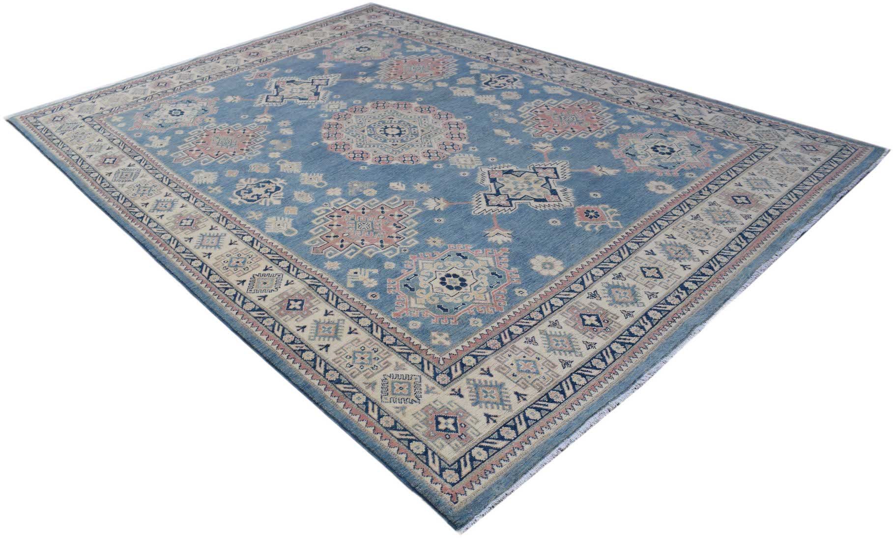 A handmade Afghan Kazakh rug featuring traditional geometric motifs in blue, cream, and pink tones.