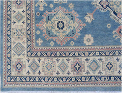 Handmade Afghan Kazakh rug featuring traditional geometric motifs in blue, cream, and pink wool.