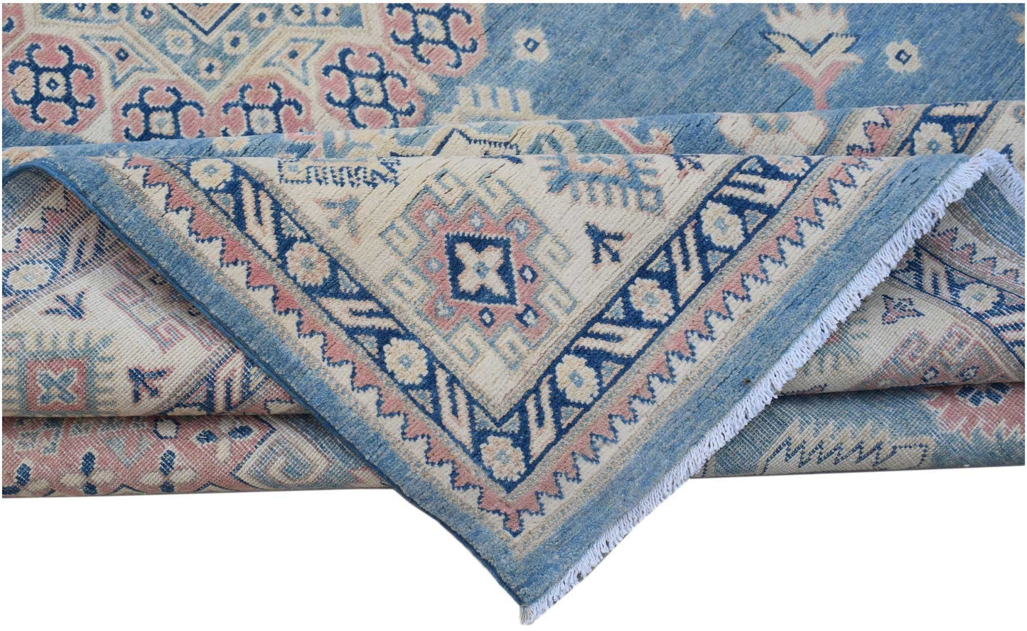 A handmade Afghan Kazakh rug featuring traditional geometric motifs in blue, pink, and cream.