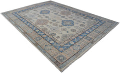 Handmade Afghan Kazakh rug featuring traditional geometric patterns in blue and beige tones.
