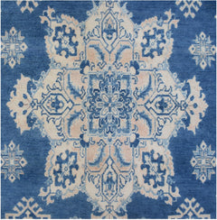 Handmade Afghan Kazakh rug featuring a central blue and beige geometric medallion pattern.