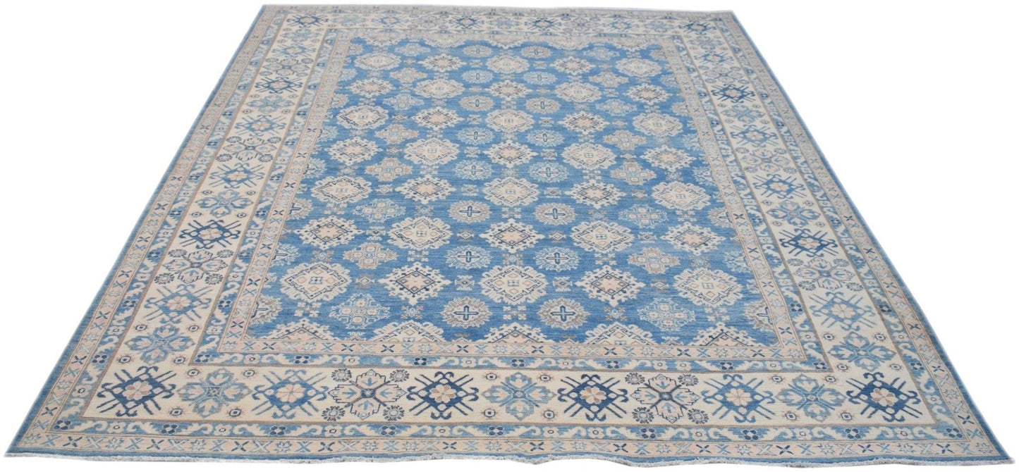 Handmade Afghan Kazakh rug featuring a blue field with beige geometric patterns and a wide border.