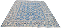 Handmade Afghan Kazakh rug featuring a blue field with beige geometric patterns and a wide border.