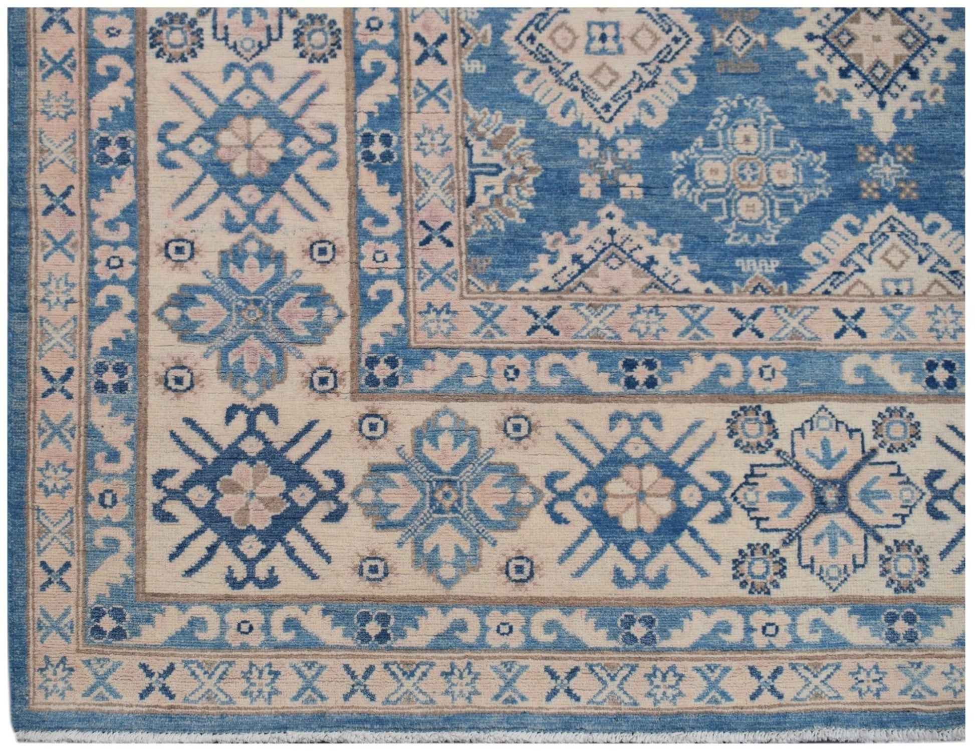 Handmade Afghan Kazakh rug featuring a geometric floral pattern in shades of blue and beige.