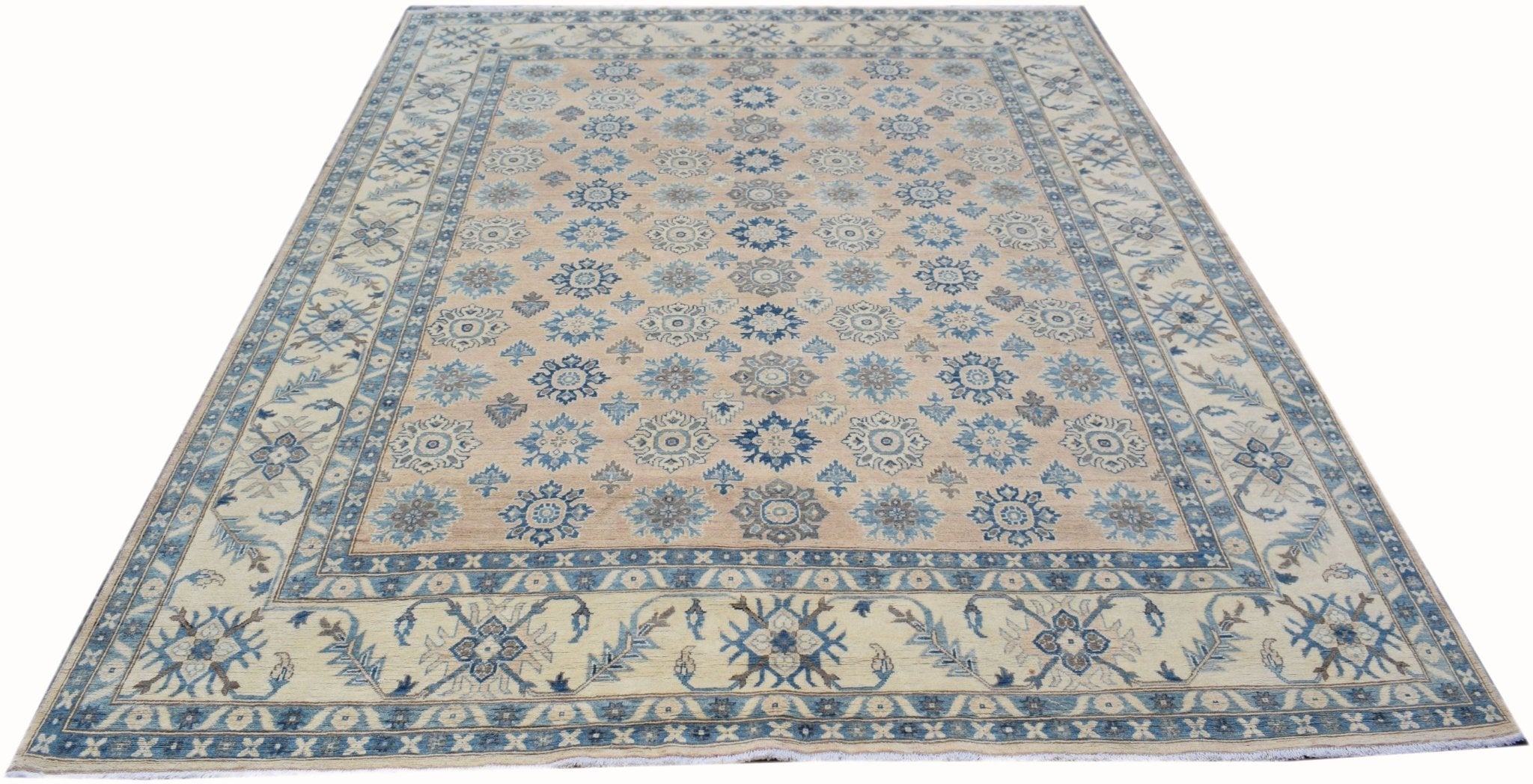 Handmade Afghan Kazakh rug featuring a repeating blue floral pattern on a light tan background.