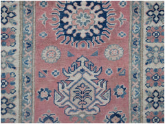 Handmade Afghan Kazakh runner rug featuring traditional geometric motifs in pink, blue, and cream.