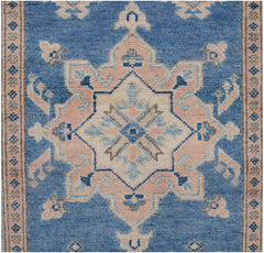Handmade Afghan Kazakh runner featuring a central geometric medallion in blue, beige, and grey.