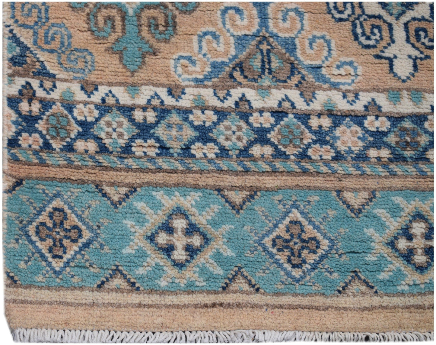 Handmade Afghan Kazakh runner rug featuring geometric patterns in shades of blue and beige.