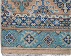 Handmade Afghan Kazakh runner rug featuring geometric patterns in shades of blue and beige.
