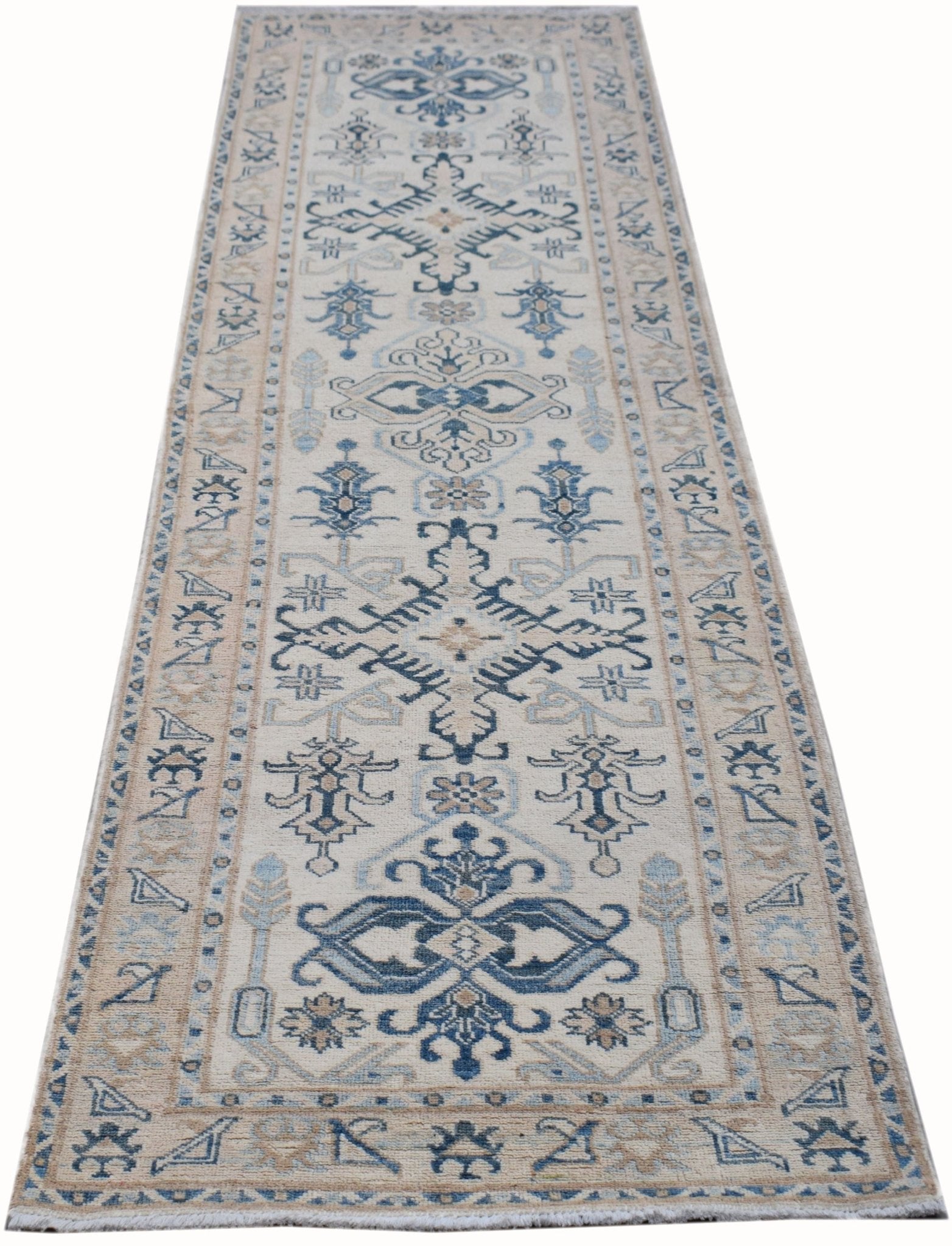 A handmade Afghan Kazakh runner rug featuring traditional blue and beige geometric patterns.