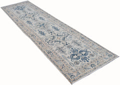 Handmade Afghan Kazakh runner rug featuring traditional blue and beige geometric patterns.