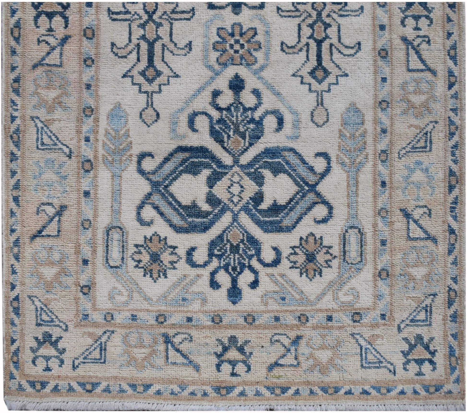 Handmade Afghan Kazakh runner featuring a traditional blue and beige geometric pattern.