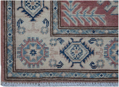 Handmade Afghan Kazakh runner featuring traditional geometric motifs in blue, pink, and cream.