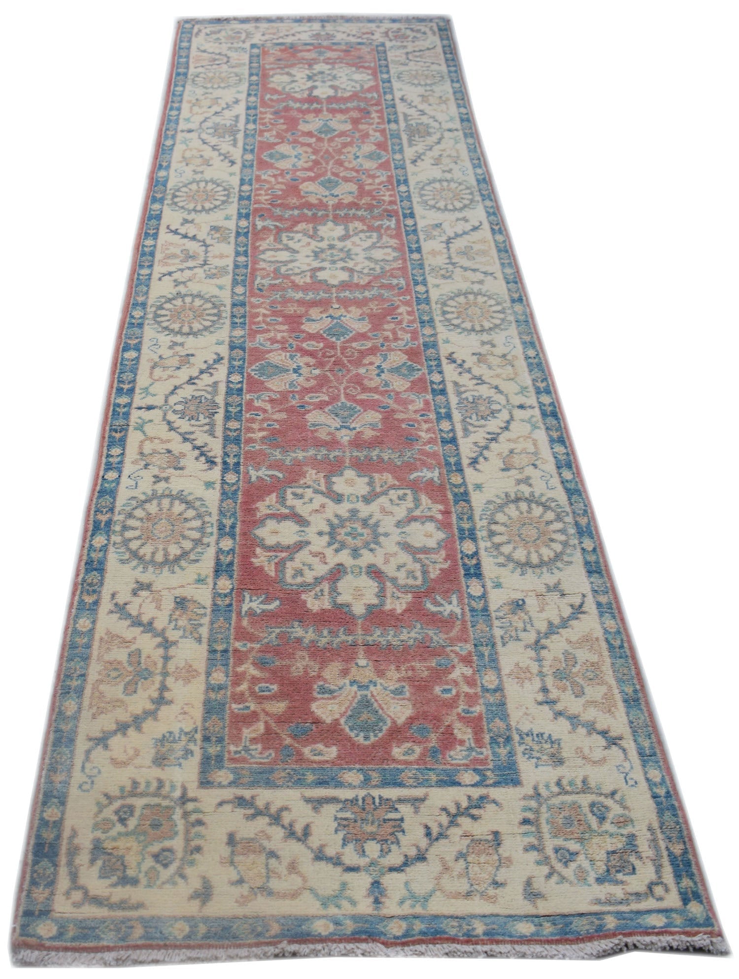A handmade Afghan Kazakh runner rug featuring traditional floral motifs in red, blue, and cream.
