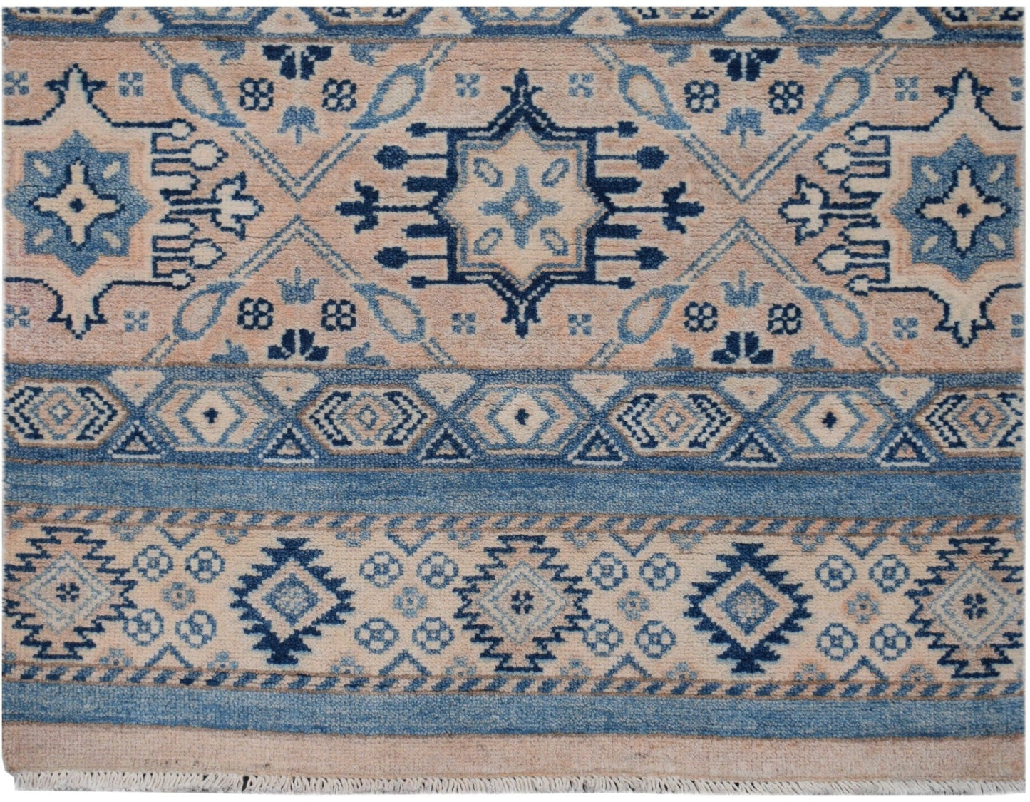 Handmade Afghan Kazakh runner rug featuring geometric patterns in shades of blue and beige.