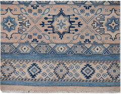 Handmade Afghan Kazakh runner rug featuring geometric patterns in shades of blue and beige.