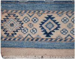 Handmade Afghan Kazakh runner featuring geometric blue and beige tribal patterns.