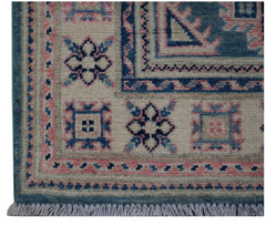 Handmade Afghan Kazakh runner featuring traditional geometric motifs in blue, pink, and cream.
