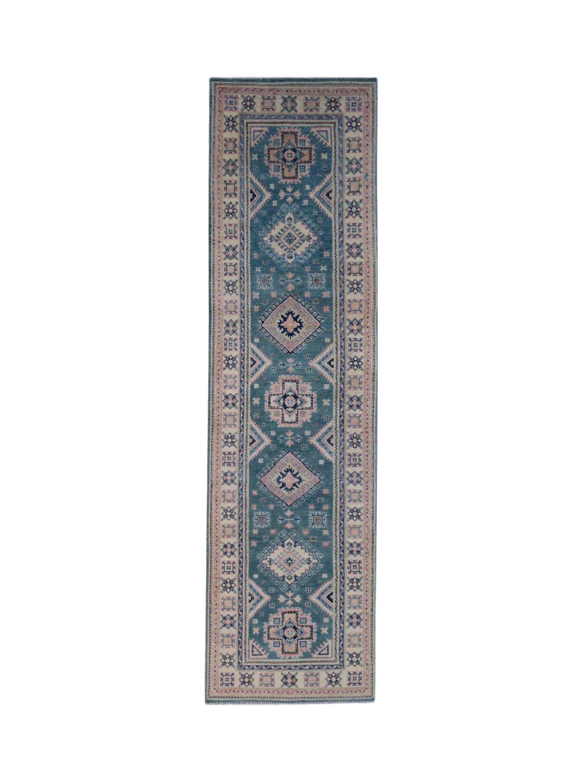 A handmade Afghan Kazakh runner rug featuring traditional geometric motifs in blue and pink tones.