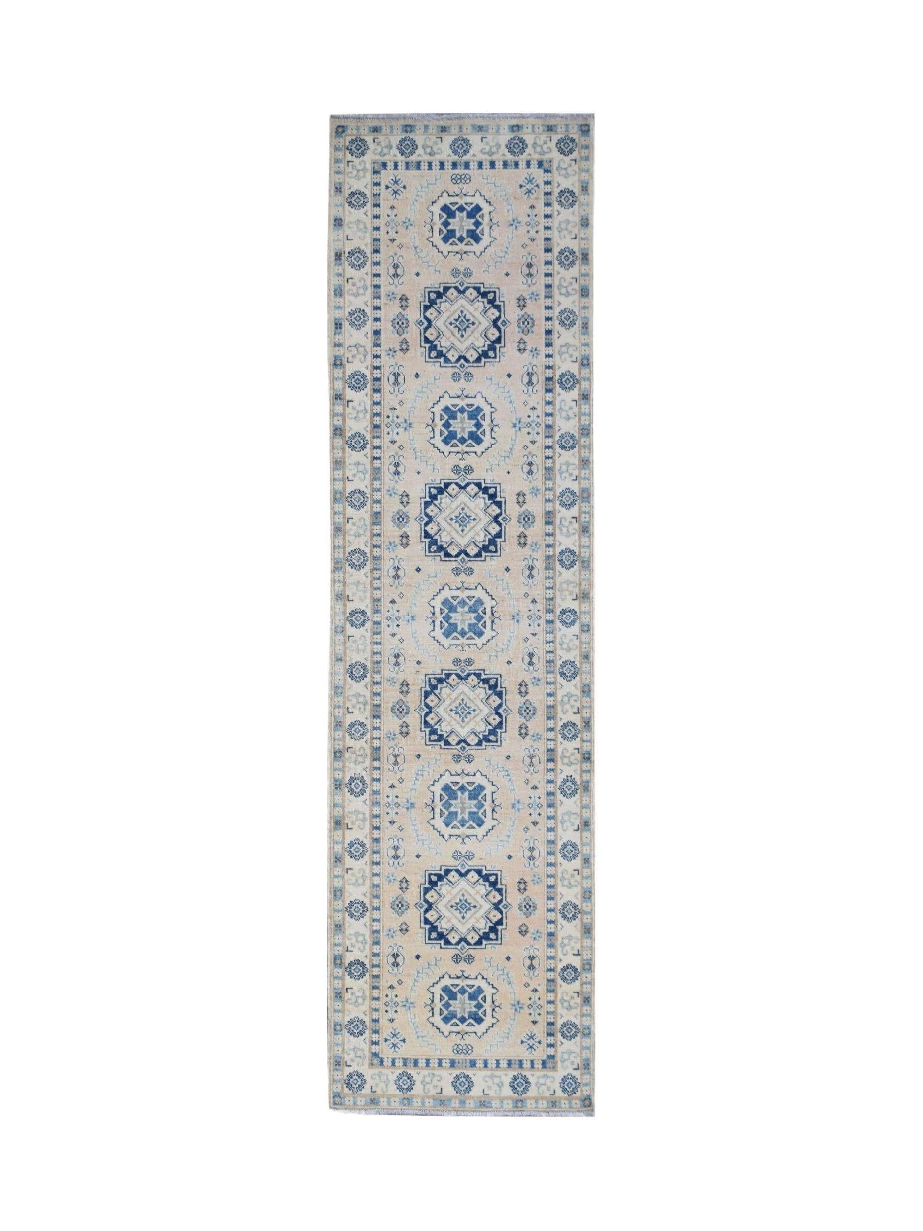 Handmade Afghan Kazakh runner rug featuring blue geometric medallions on a cream wool background.