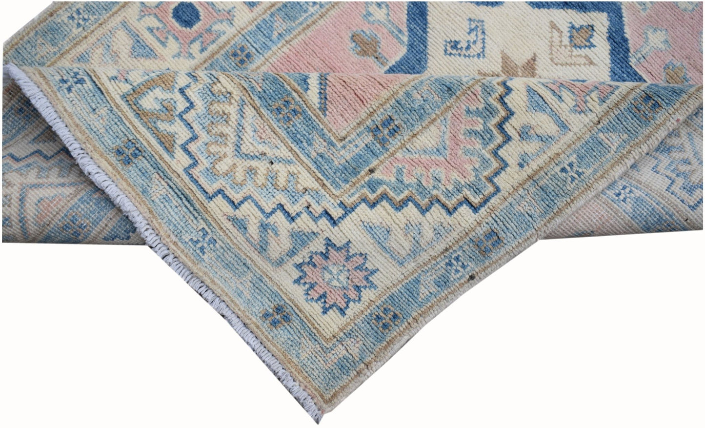 A handmade Afghan Kazakh runner featuring traditional geometric patterns in blue, pink, and cream.