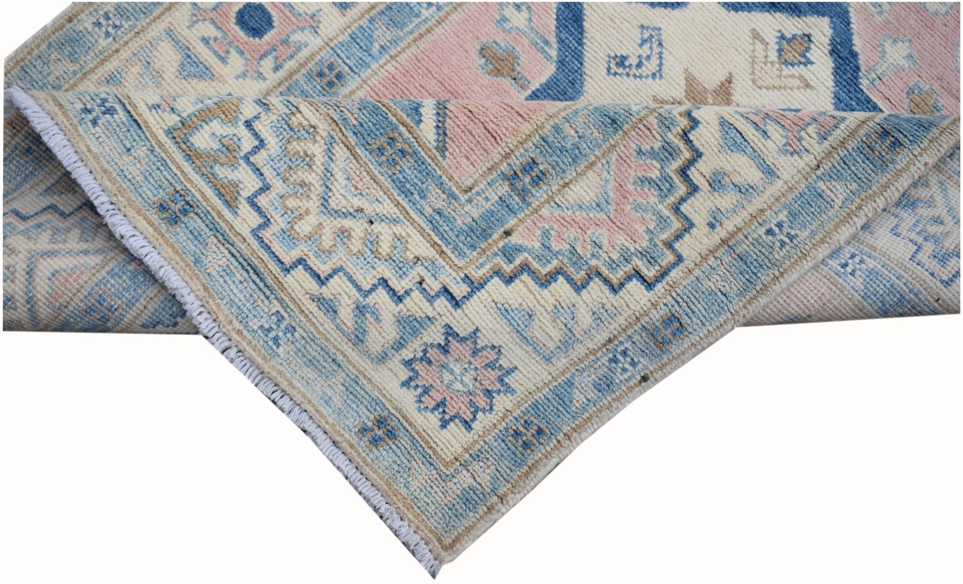 A handmade Afghan Kazakh runner featuring traditional geometric patterns in blue, pink, and cream.