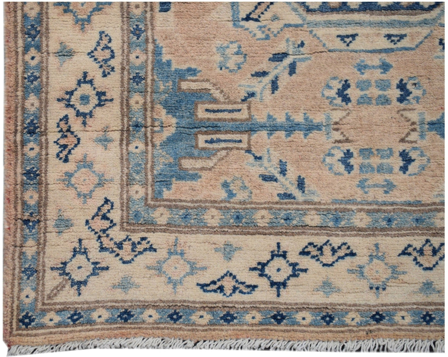 Handmade Afghan Kazakh runner rug featuring a geometric pattern in shades of beige and blue.