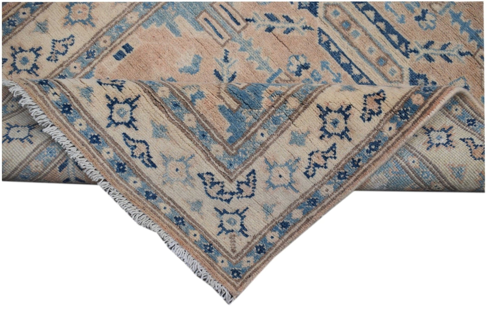 Handmade Afghan Kazakh runner rug featuring a beige field with blue and grey geometric patterns.