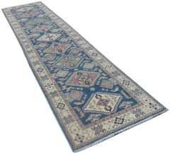 A handmade Afghan Kazakh runner rug featuring traditional geometric motifs in blue and cream tones.
