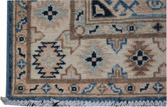 Handmade Afghan Kazakh runner rug featuring geometric patterns in beige, blue, and grey tones.