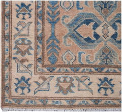 Handmade Afghan Kazakh runner featuring a geometric pattern in shades of beige and blue.
