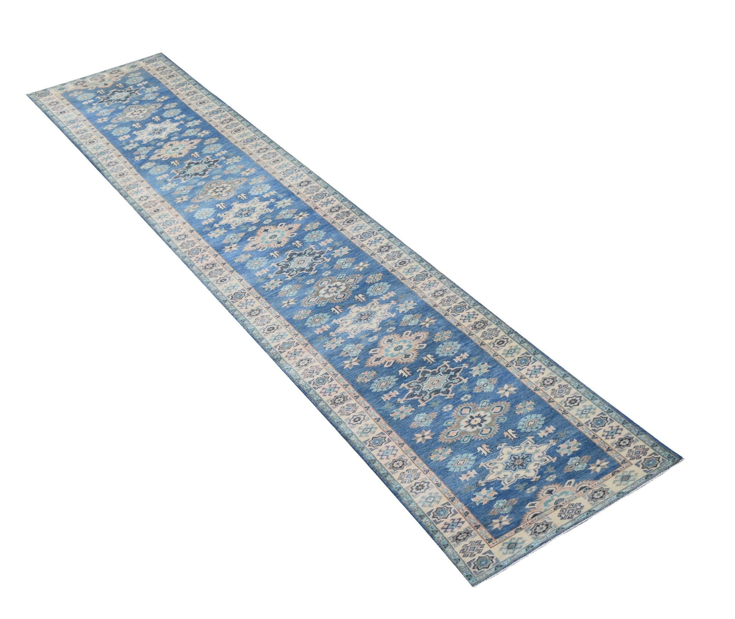 A long, handmade Afghan Kazakh runner rug featuring a blue field with intricate beige patterns.