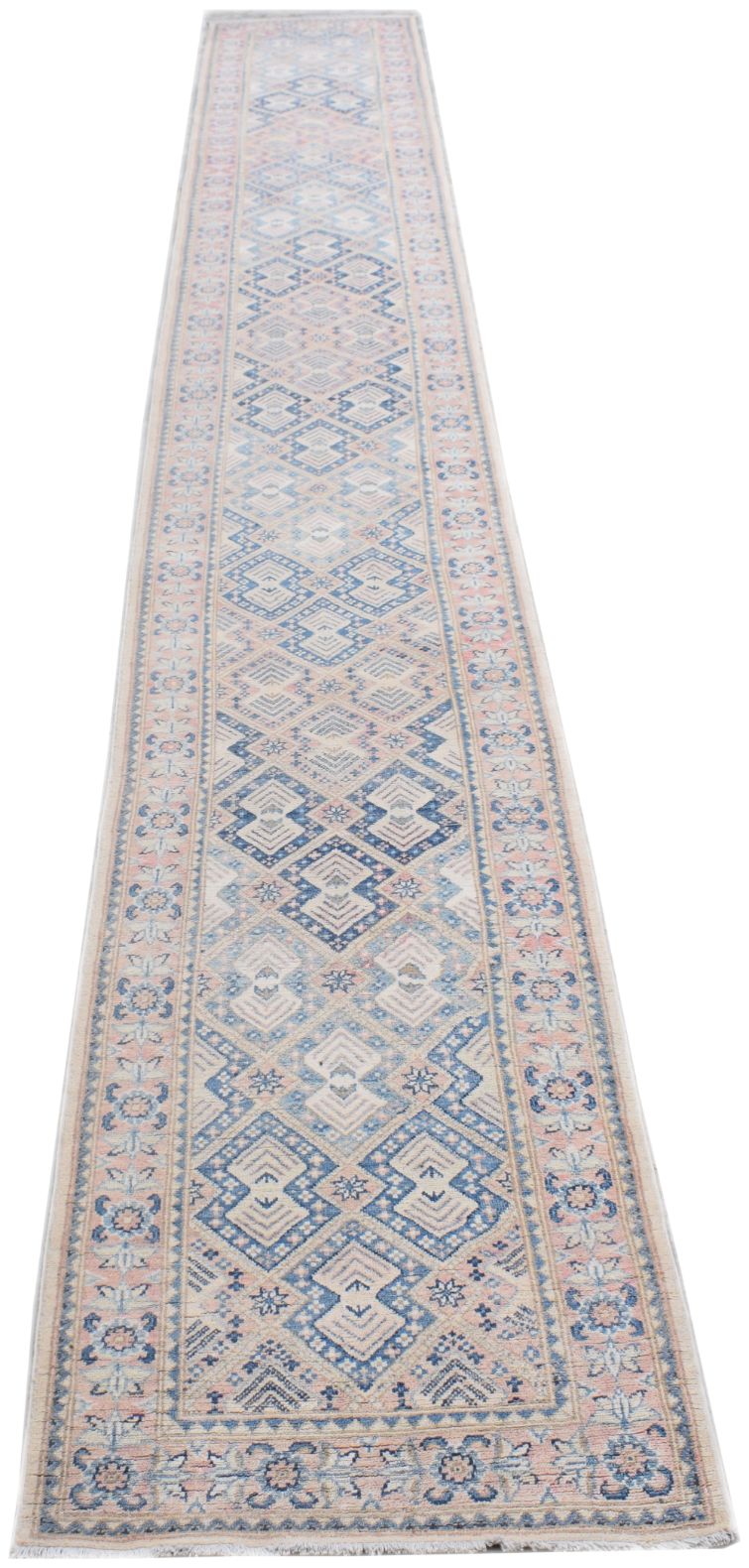 A long, handmade Afghan Kazakh runner rug featuring a geometric diamond pattern in blue, beige, and pink.