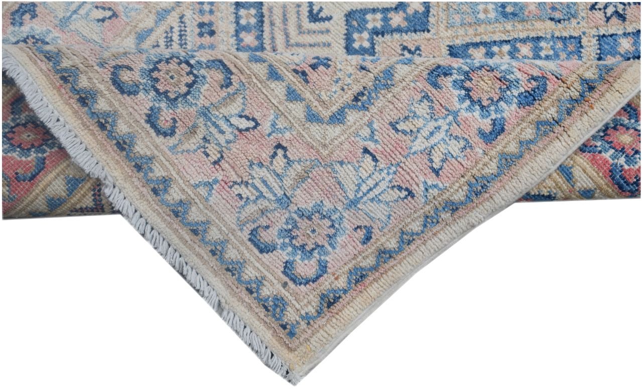 A handmade Afghan Kazakh runner featuring a traditional floral pattern in blue, pink, and beige.