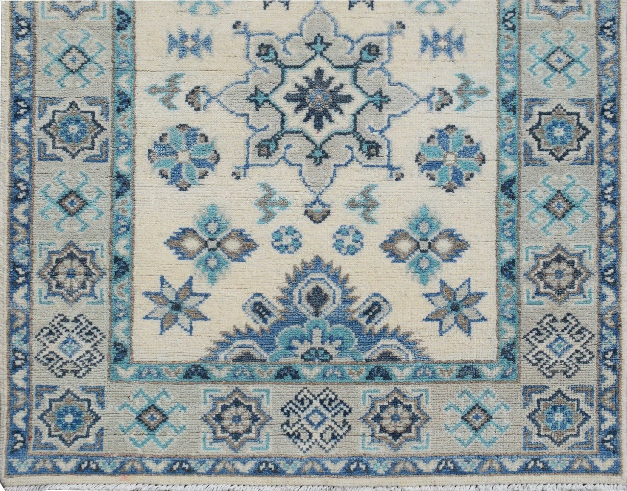 Handmade Afghan Kazakh runner featuring a geometric floral pattern in shades of blue, grey, and beige.