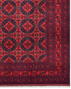 Handmade Afghan Khal Mohammadi wool rug featuring a geometric pattern in deep red and blue tones.