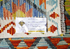 A handmade Afghan Maimana Kilim rug featuring a vibrant geometric pattern in wool.