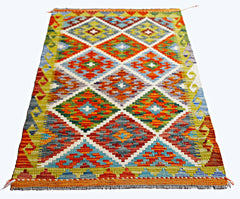 Handwoven Afghan Maimana kilim rug featuring a vibrant geometric diamond pattern in wool.
